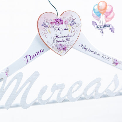 Personalized hangers for the bride and groom with pastel roses